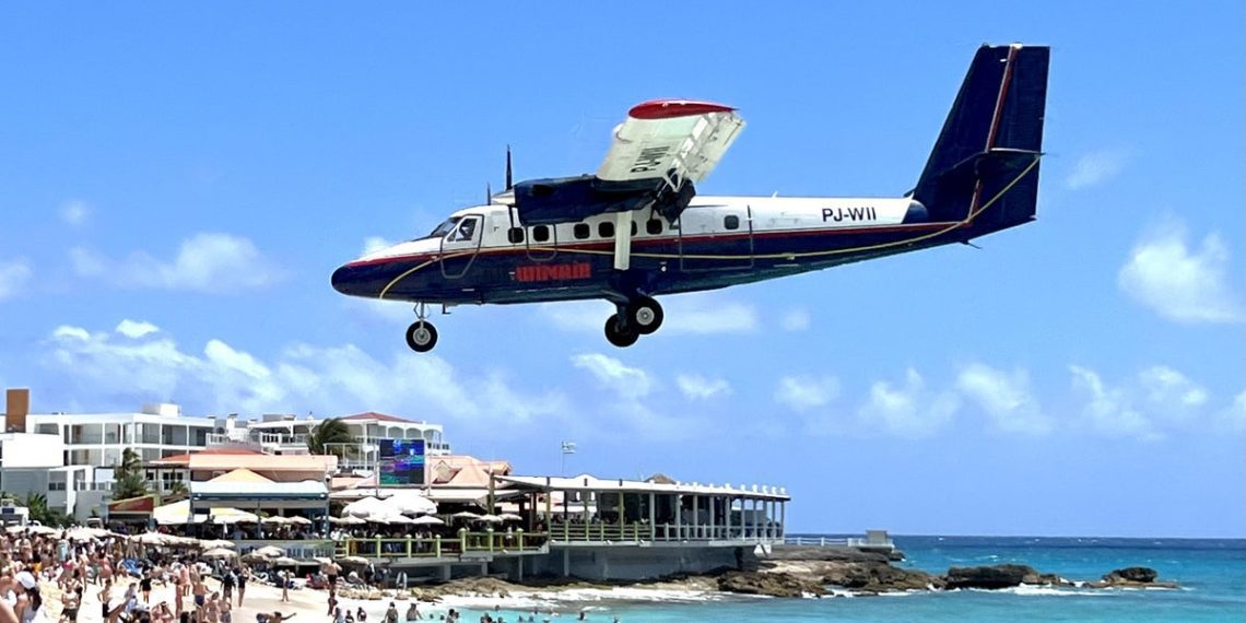 WANAIR flight landing in Sint Maarten over Maho Beach