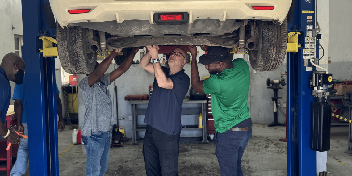 Participants receivined hands-on training in electric vehicle maintenance and repair during an EV training program. (COURTESY GSI SKN)