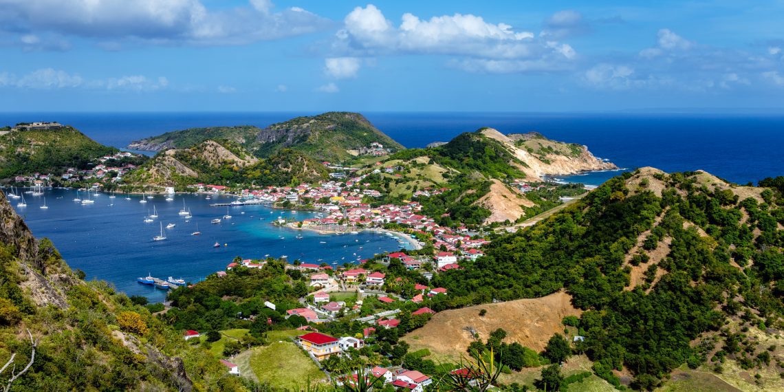 fLes Saintes, Terre-de-Haut, Iles des Saintes, Les Saintes, Guadeloupe, Lesser Antilles, Caribbean. View from the Le Chameau hiking trail. The bay of Les Saintes i