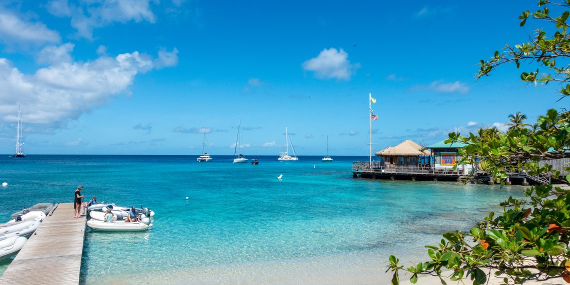 Looking from the dinghy dock to the celebrated Basil’s Bar, a must-do stop for many of Mustique’s visiting sailors. (LEXI FISHER)